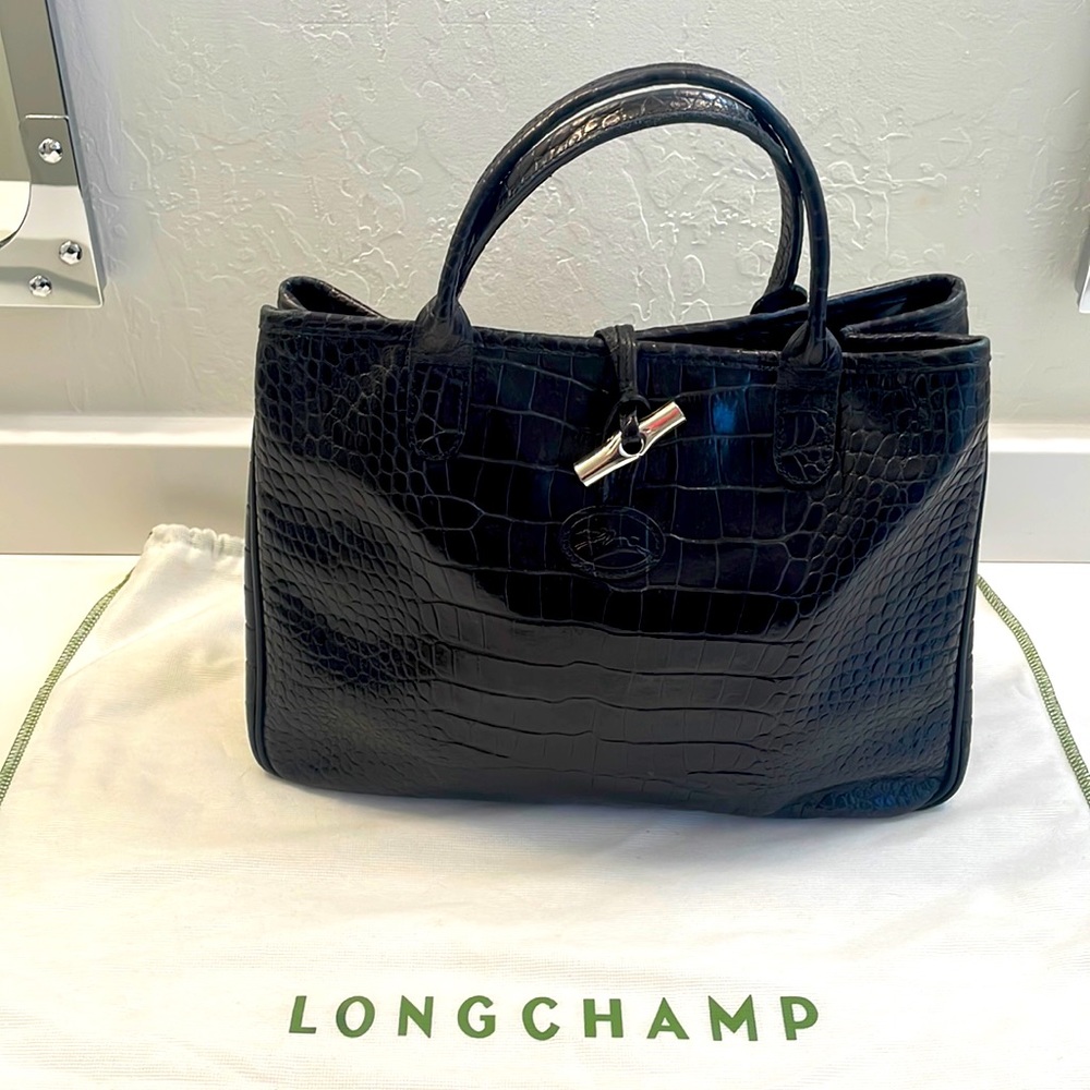 Black embossed leather handbag